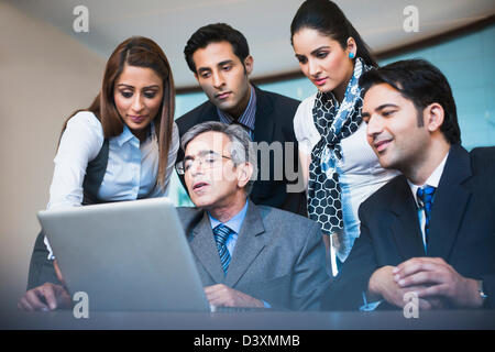 Business executives working on a laptop Stock Photo