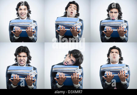 Multiple images of a businessman carrying stack of files making different faces Stock Photo