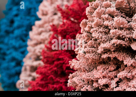 Flocked Christmas Tree with multi colors. Stock Photo