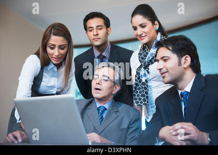 Business executives working on a laptop Stock Photo