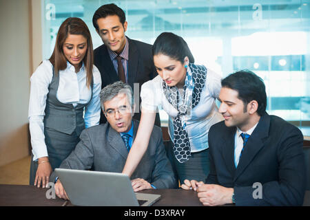Business executives working on a laptop Stock Photo