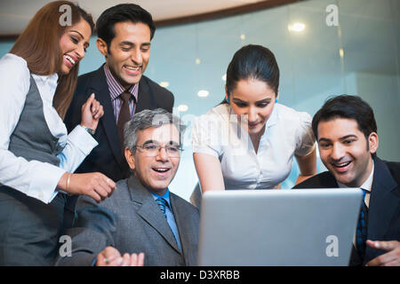 Business executives working on a laptop Stock Photo