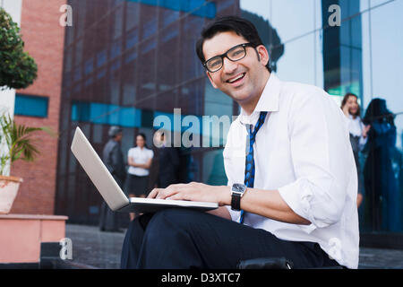 Businessman working on a laptop Stock Photo