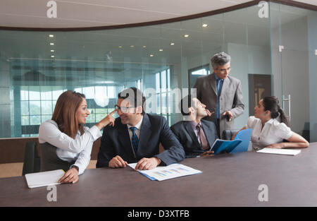 Business executives discussing in a meeting Stock Photo
