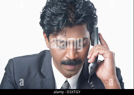 South Indian businessman talking on a phone Stock Photo