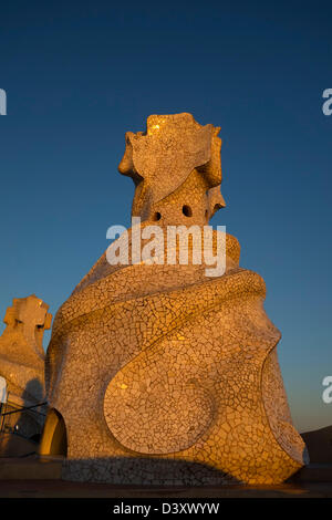 Detail of chimneys at the terrace of the Casa Milà or La Pedrera designed by Antoni Gaudi at sunset, Barcelona, Spain, Europe Stock Photo