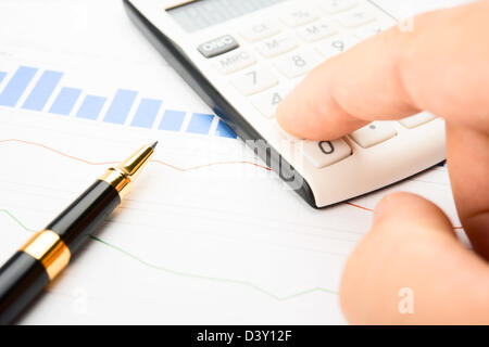 Businessman analysis of quotes Stock Photo