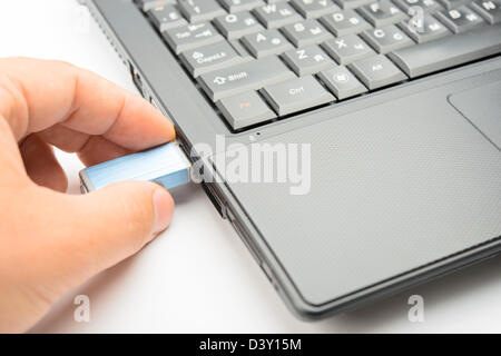 Connecting of flashdrive to the notebook Stock Photo