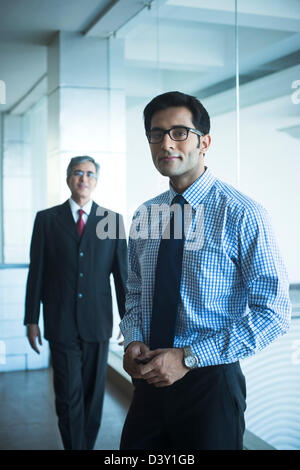 India, Two businessmen walking down stairs Stock Photo - Alamy