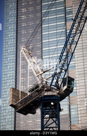Crane on construction site in front of Heron Tower in the City of London. Stock Photo