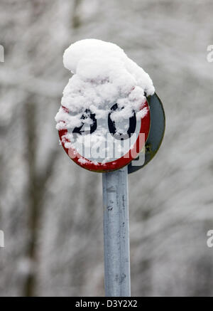 A snow covered 40 miles per hour speed limit sign. Stock Photo