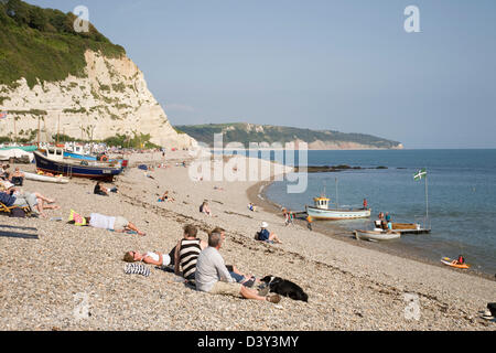 Holidaymakers on Beer beach in Devon, England. Stock Photo