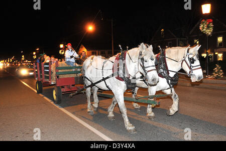 A horse drawn carriage ride at night in Old Saybrook, CT USA Stock Photo