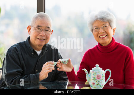 Chinese couple having tea together Stock Photo