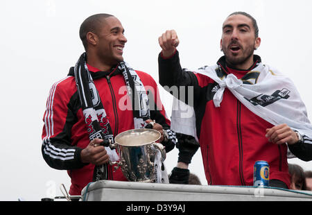 Swansea, Wales, UK. 26th February 2013. Ashley Williams and Chico Flores celebrating winning the Captial Cup trophy at Wembley on Sunday with an open top bus homecoming parade through the centre of Swansea. Credit:  Phil Rees / Alamy Live News Stock Photo