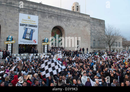 Swansea, Wales, UK. 26th February 2013. Swansea City FC fans outside the Brangwyn Hall in Swansea tonight during celebrating in the city after their Capital Cup win in Wembley at the weekend. Credit:  Phil Rees / Alamy Live News Stock Photo