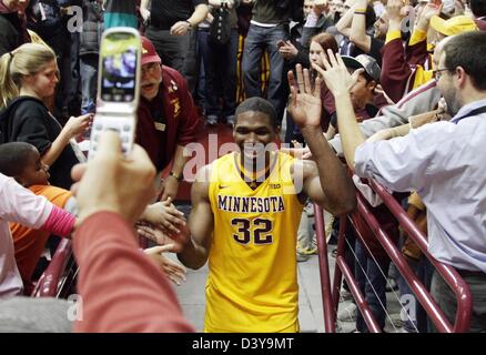 Minneapolis, USA. 26th February 2013. Minnesota Gophers forward Trevor Mbakwe (32) is congratulated by fans while leaving the court after Minnesota defeated the number one ranked Indiana Hoosiers at Williams Arena in Minneapolis, Minnesota. Minnesota defeated Indiana 77 - 73.  Credit:  Cal Sport Media / Alamy Live News Stock Photo