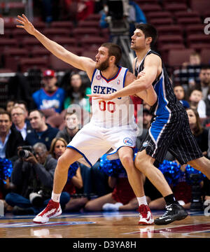 Philadelphia, Pennsylvania, USA. 26th February 2013.  76ers' forward/center Spencer Hawes (00) tries to get low post position on Magic's center Nikola Vucevic (9) in the 1st half during NBA action between the Philadelphia 76ers and Orlando Magic at Wells Fargo Center in Philadelphia, Pennsylvania. Credit:  Cal Sport Media / Alamy Live News Stock Photo