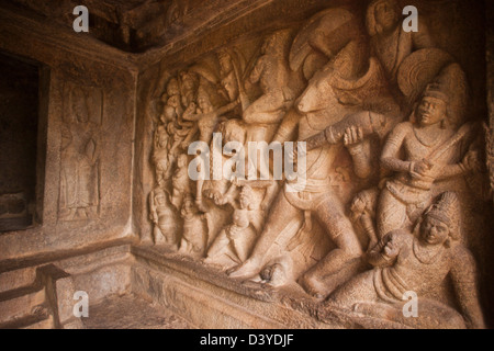 Bas Relief depicting conflict of Durga with Mahishasura at Mahishasuramardhini Mandapam, Mahabalipuram, Tamil Nadu, India Stock Photo