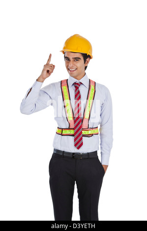 Male architect pointing and smiling Stock Photo