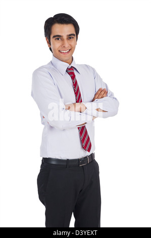 Smiling businessman standing with arms crossed Stock Photo - Alamy