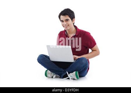 Happy man using a laptop Stock Photo