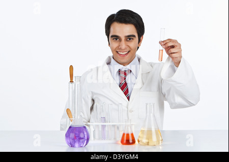 Male scientist working in a laboratory and smiling Stock Photo