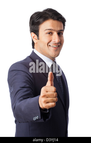 Businessman gesturing thumbs up Stock Photo