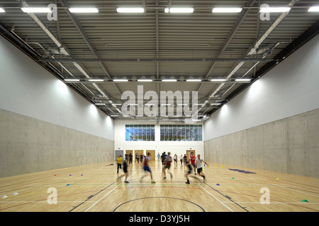 Bournville College, Birmingham, United Kingdom. Architect: Broadway Malyan Limited, 2011. Gymnasium with students at play. Stock Photo