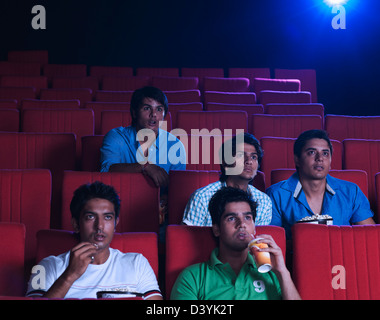 Youngsters enjoying movie in a cinema hall