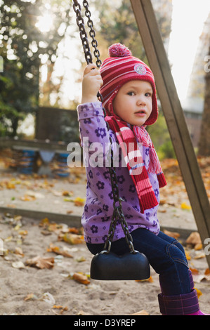 Girl on Swing, Germany Stock Photo