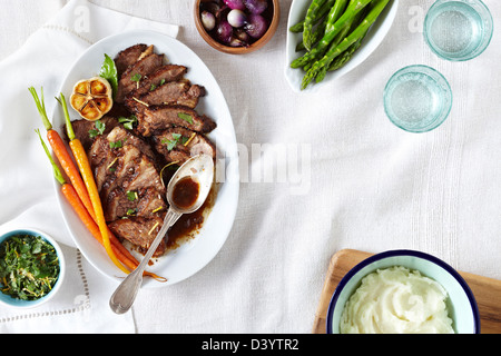 Beef Brisket with Herbs, Asparagus, Mashed Potatoes and Pearl Onions Stock Photo