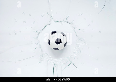 Soccer Ball and Broken Glass Stock Photo