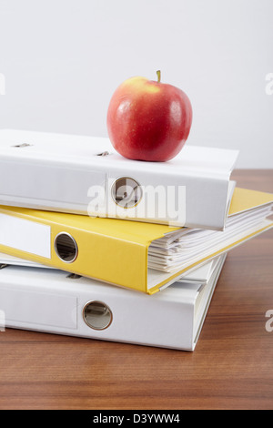 Stack of Binders and Apple Stock Photo