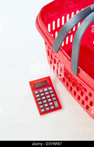 Calculator and Shopping Basket Stock Photo