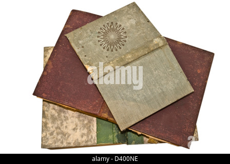 Three old books opened face down showing the front and back covers. Stock Photo