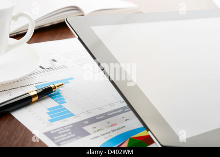 Tablet computer with blank screen on a businessman workplace Stock Photo
