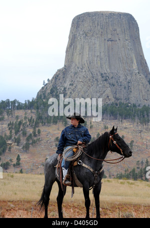 Devils Tower, Bear Lodge with cowboy in Black Hills near Hulett Wyoming, Ingneous intrusion of laccolith in Black Hills, Stock Photo