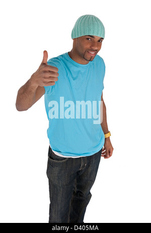 Smiling young man in a blue t-shirt with thumb up. Isolated on white background. Stock Photo