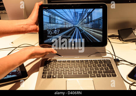 Barcelona, Spain. 27th February 2013: An employee  displays the HP ENVY at the Mobile World Congress 2013. Stock Photo