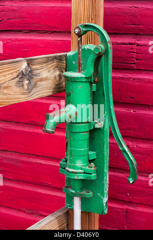 Green manual pump from well Stock Photo