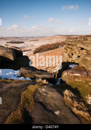 Looking North West from near Robin Hoods Cave, Stanage Edge on a wintry morning in the Peak District National Park Stock Photo