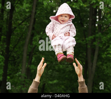 Baby flying in the park Stock Photo