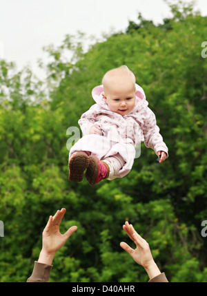 Baby flying in the sky Stock Photo