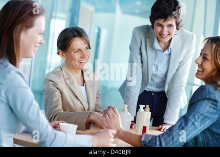 Image of four businesswomen having friendly talk Stock Photo