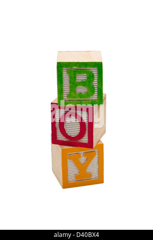 Wooden blocks stacked that spell out boy. Isolated on white background. Stock Photo