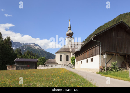 St. Rochus Chapel in Alpine village with flower meadow in summer. Biberwier, Tyrol, Austria, Europe Stock Photo