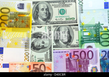 Euro banknotes of different denominations and 100 Dollars banknotes Stock Photo