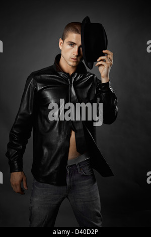 Young caucasian man in men's fashion photo taken in studio Stock Photo