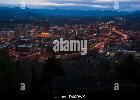 Asheville, North Carolina cityscape and mountain skyline at late dusk. Stock Photo